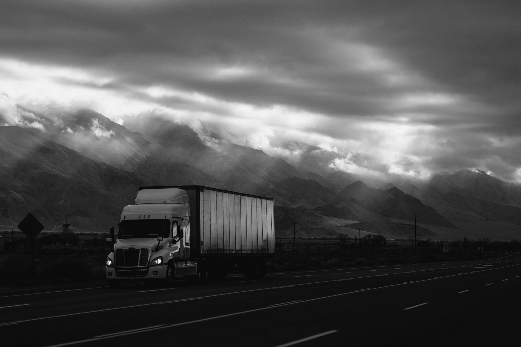 A tractor-trailer on an open highway